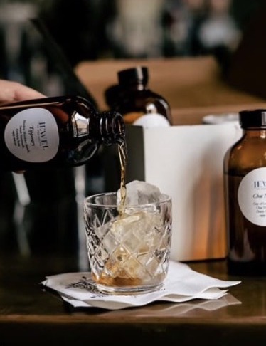 Craft cocktail being poured tableside